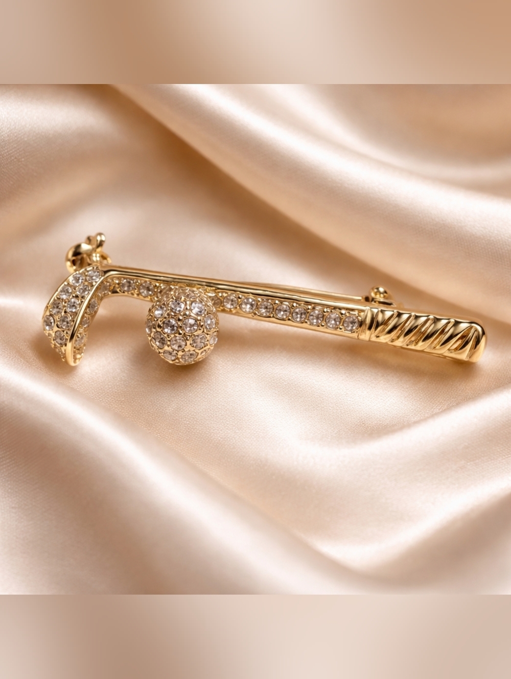 Jewel Embellished gold tone gold bin/brooch.
